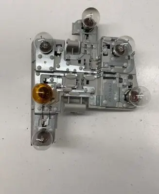 Tail light bulb cover holder