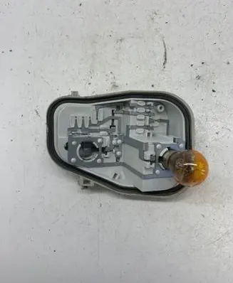 Tail light bulb cover holder