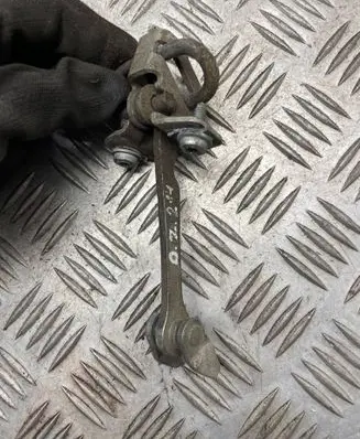 Front door check strap stopper