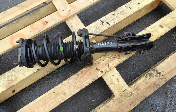 Front shock absorber with coil spring