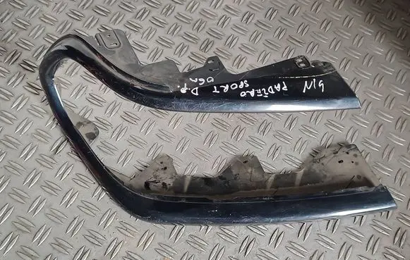 Mitsubishi Pajero Sport I Under headlight/headlamp trim 10087415