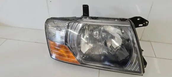 Mitsubishi Pajero Headlight/headlamp 10087420 H412V6055W