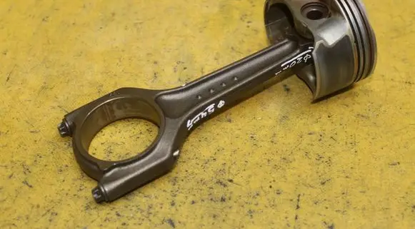 Piston with connecting rod
