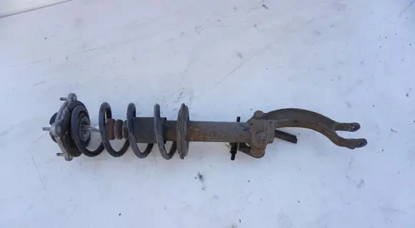 Renault Megane III Front shock absorber with coil spring MCPERSON