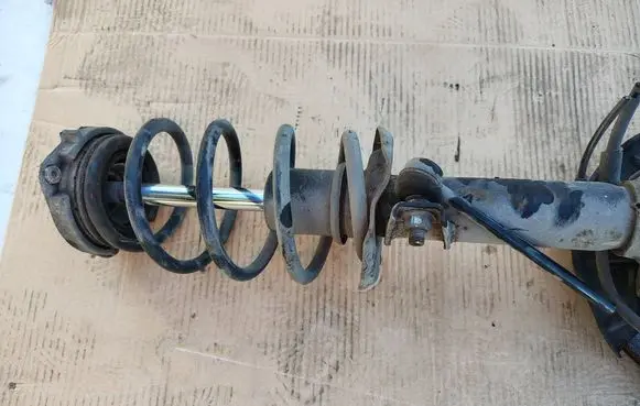Front shock absorber with coil spring