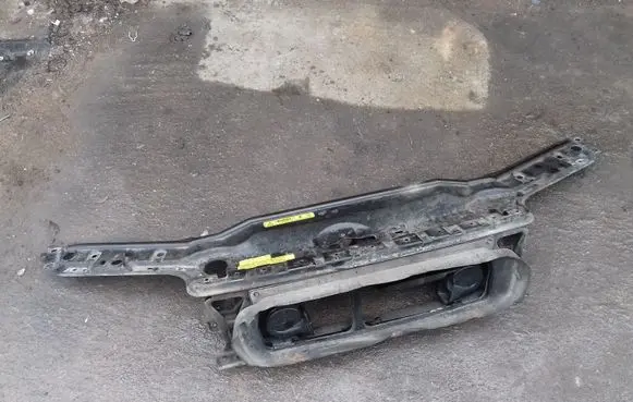 Top upper radiator support slam panel
