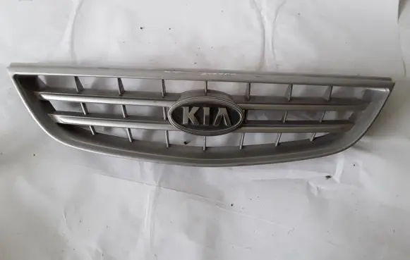 KIA Carens I Front bumper upper radiator grill 0K2EF50710