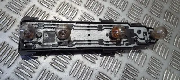 Tail light bulb cover holder