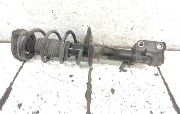 Nissan Juke I F15 Front shock absorber with coil spring 543023YW0A