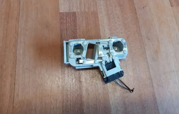 Tail light bulb cover holder