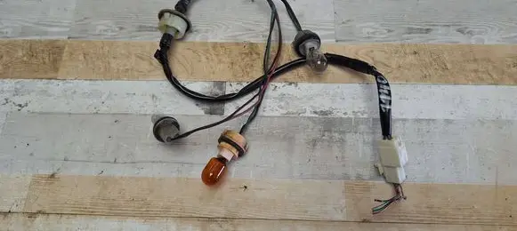 Mazda 5 Tail light bulb cover holder 