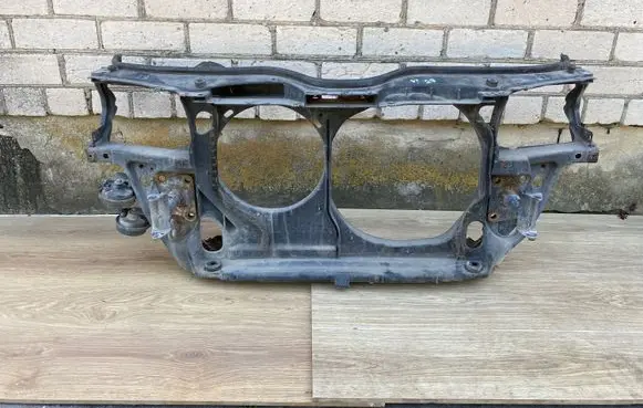 Radiator support slam panel