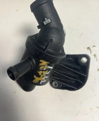 Volkswagen Golf VI Thermostat/thermostat housing 03L121111AE