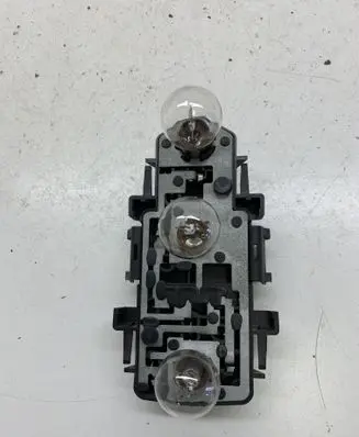 Tail light bulb cover holder