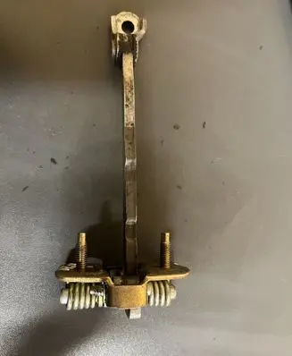 Front door check strap stopper