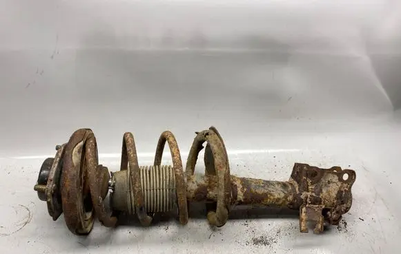 Nissan Almera Tino Front shock absorber with coil spring
