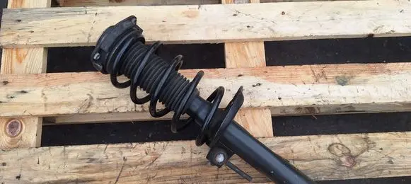 Volkswagen PASSAT CC Front shock absorber with coil spring G16497