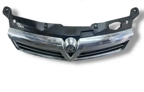 Opel Astra H Front bumper upper radiator grill 13225791 13225788