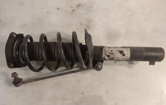 Volkswagen Jetta V Front shock absorber with coil spring 1T0413031G