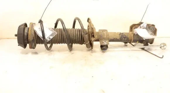 Suzuki Swift I Front shock absorber with coil spring