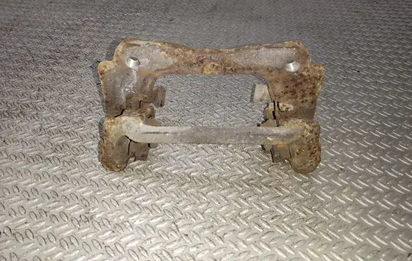Toyota Avensis T250 Brake caliper pad carrier rear 