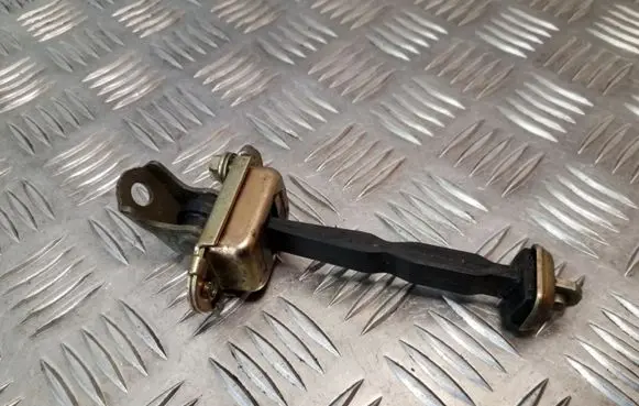 Front door check strap stopper