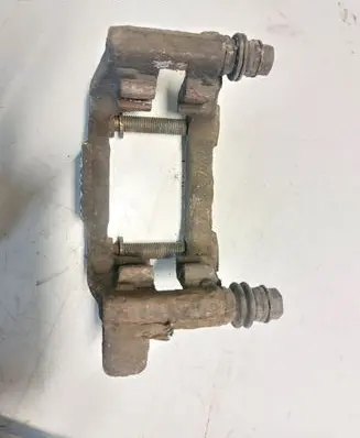 Volkswagen Touran I Brake caliper pad carrier rear 