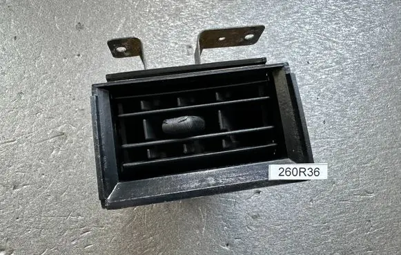 Nissan Patrol 260 Dashboard side air vent grill/cover trim 68750G9600