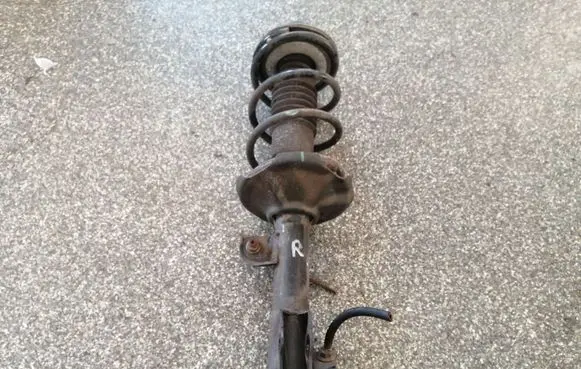 Front shock absorber with coil spring