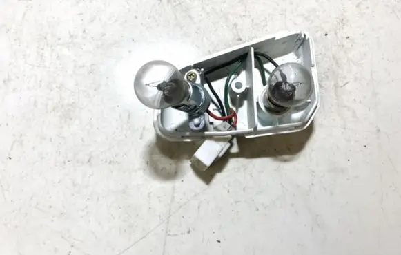 Mazda 626 Tail light bulb cover holder