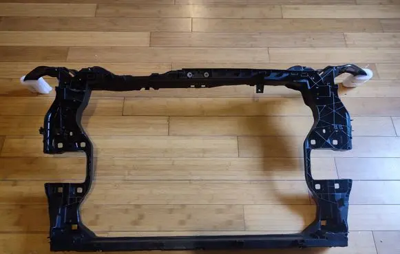 Radiator support slam panel