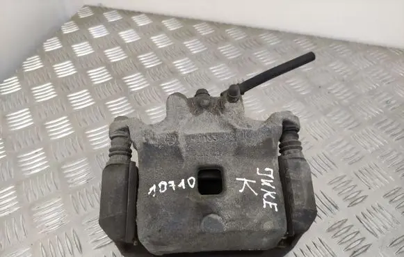 Nissan Juke I F15 Front brake caliper