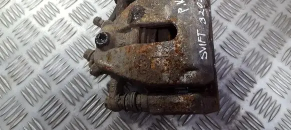 Suzuki Swift I Front brake caliper