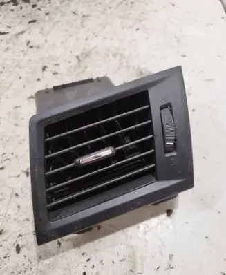 Subaru Legacy Dash center air vent grill 66110AJ000