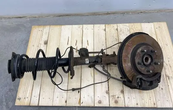 Nissan Juke I F15 Front shock absorber with coil spring