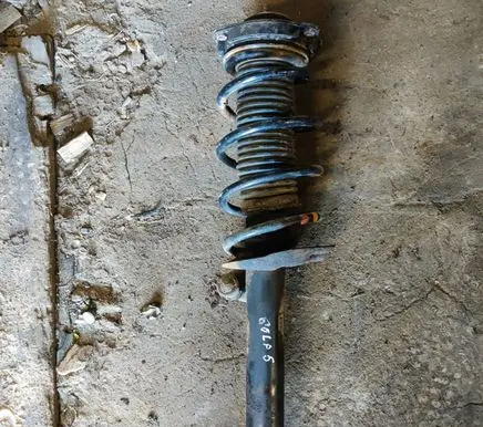 Volkswagen Golf V Front shock absorber with coil spring