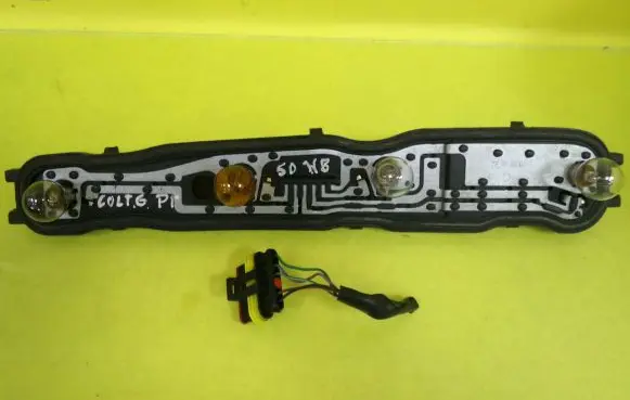 Mitsubishi Colt Tail light bulb cover holder