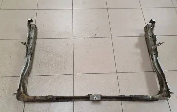 Radiator support slam panel