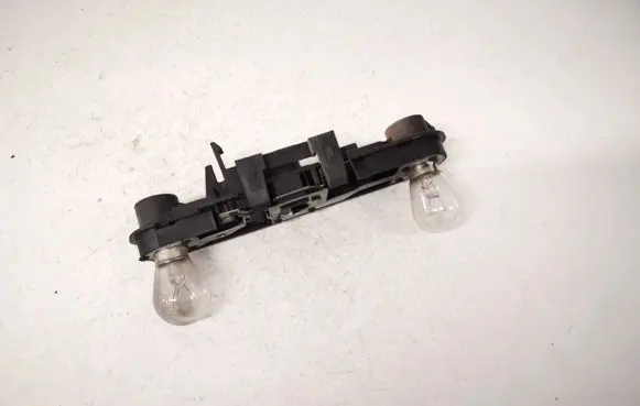 Tail light bulb cover holder