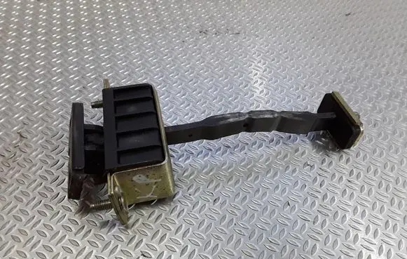 Front door check strap stopper