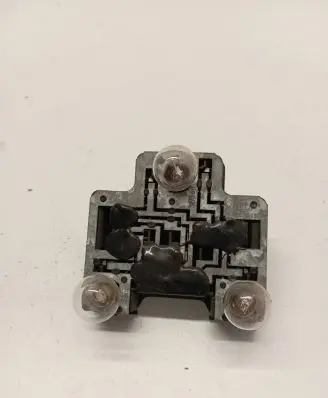 Tail light bulb cover holder