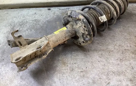 Front shock absorber with coil spring