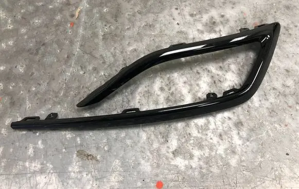 Rear bumper trim bar molding
