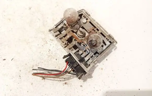 Tail light bulb cover holder