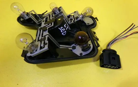 Tail light bulb cover holder