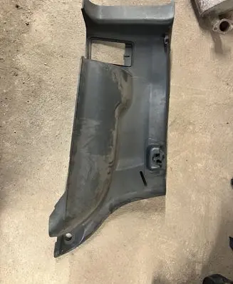 Trunk/boot lower side trim panel
