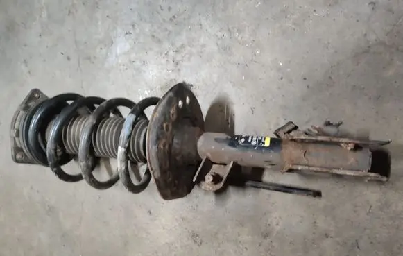 Nissan Qashqai+2 Front shock absorber with coil spring 543021D73A