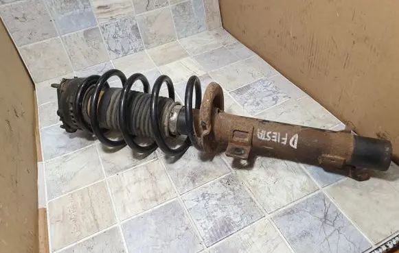Ford Fiesta Front shock absorber with coil spring 2S613K155AF