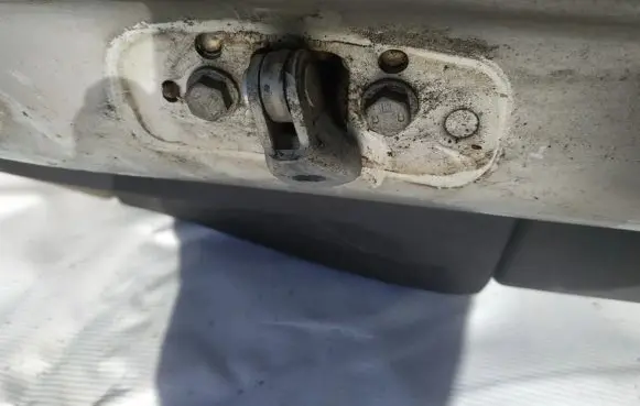 Front door check strap stopper