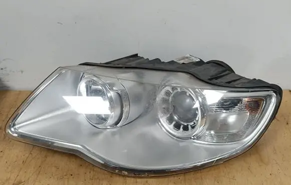 Volkswagen Touareg I Headlight/headlamp 7L6941031A 1LL24703203